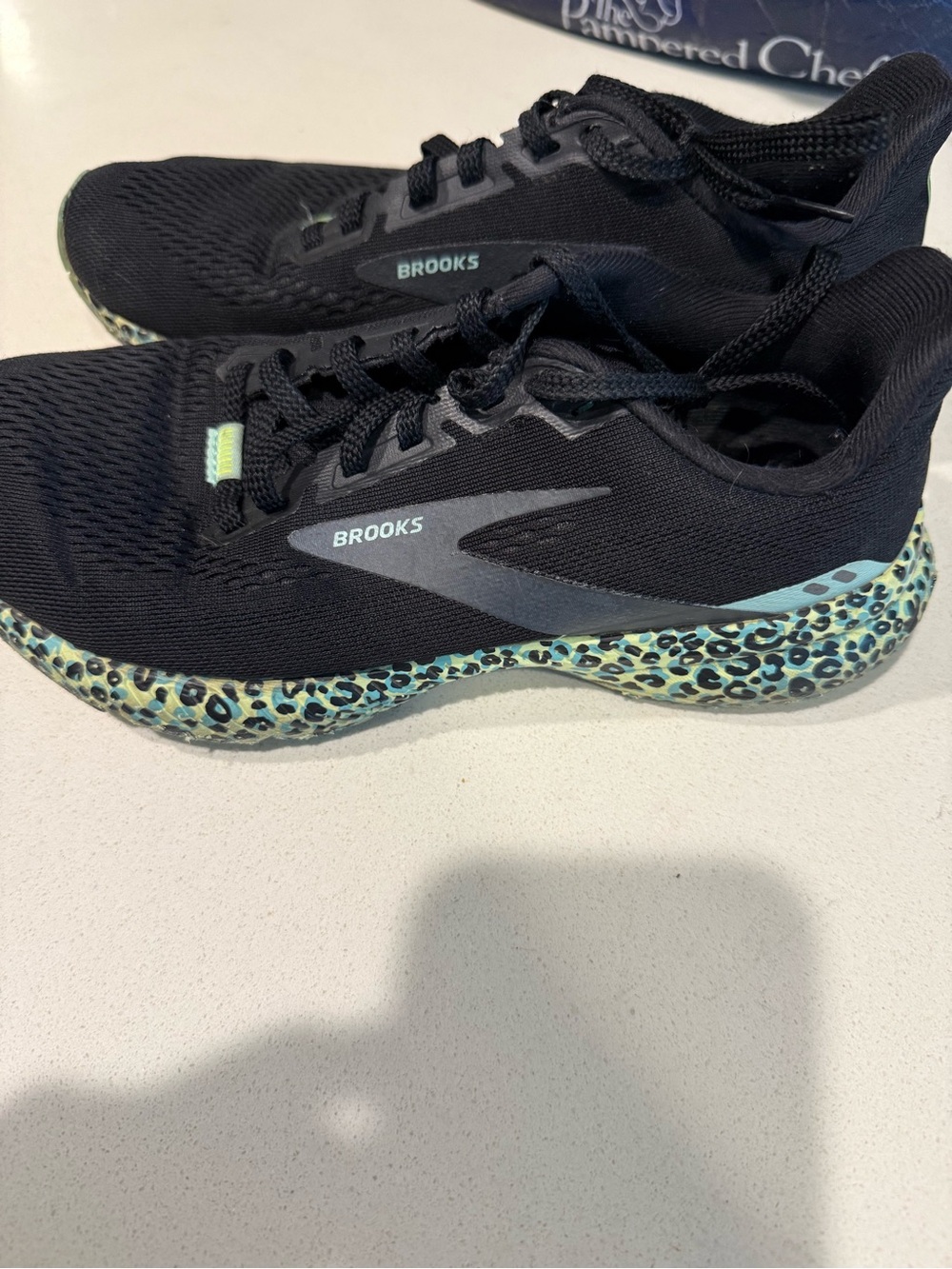 Brooks Black Athletic Shoes with Teal Leopard-Print Midsole